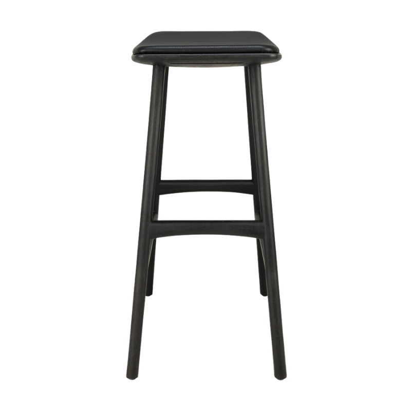 The Upholstered Osso Counter Stool from Ethnicraft with black oak wood and black leather from the side.
