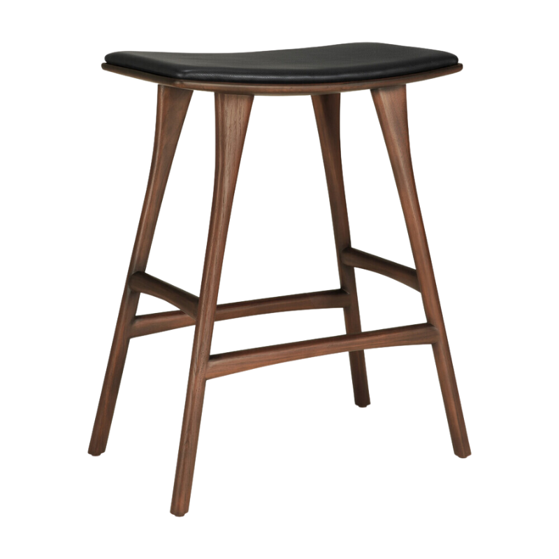 The Upholstered Osso Counter Stool from Ethnicraft with brown teak wood and black leather.