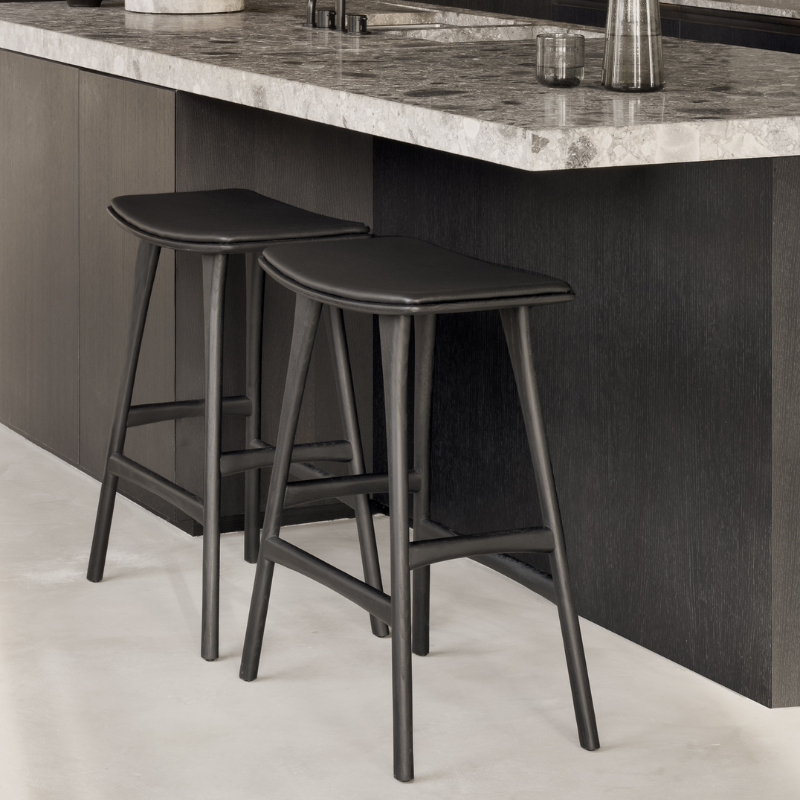 The Upholstered Osso Counter Stool from Ethnicraft in a kitchen.