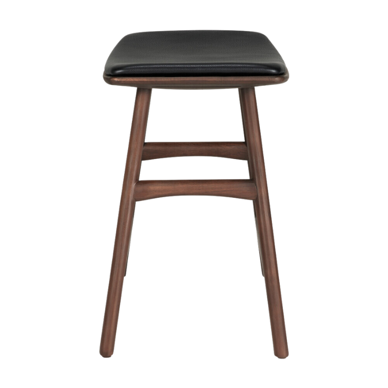 The Upholstered Osso Dining Stool from Ethnicraft with brown teak and black leather from the side.
