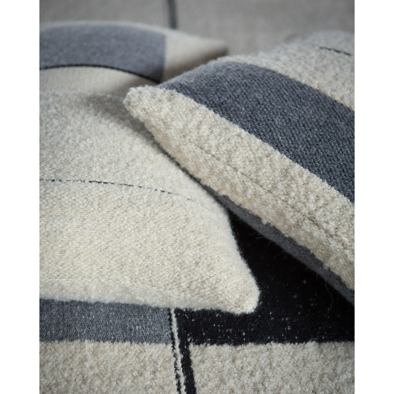 The Urban Square Cushion by Ethnicraft in a family space.