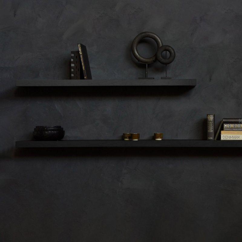 The Wall Shelf from Ethnicraft made with black oak in a bedroom.