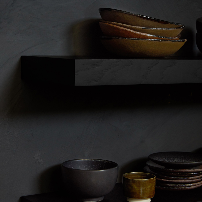 The Wall Shelf from Ethnicraft made with black oak in a dining room.