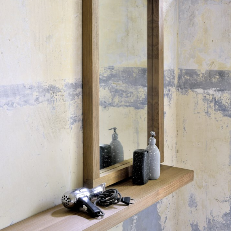 The Wall Shelf from Ethnicraft made with oak in a living room.
