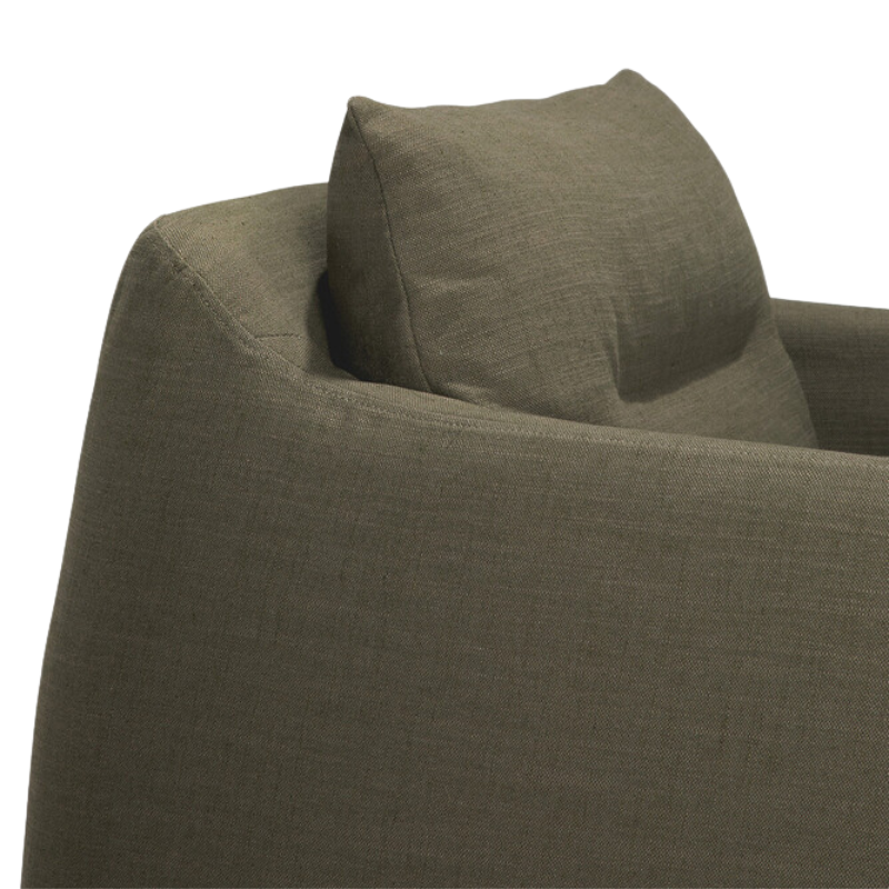 The Weave Lounge Chair by Ethnicraft in green with pillow top details.