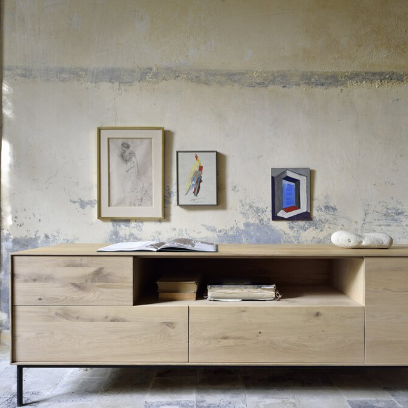 The Whitebird TV Cupboard from Ethnicraft in a living room.