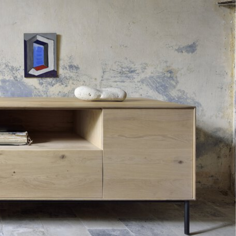 The Whitebird TV Cupboard from Ethnicraft in a lounge close up.