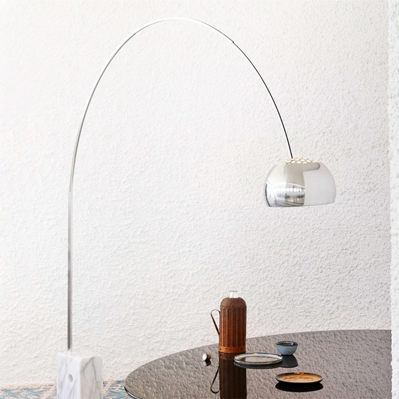 The Arco Floor Lamp from Flos in a dining area.