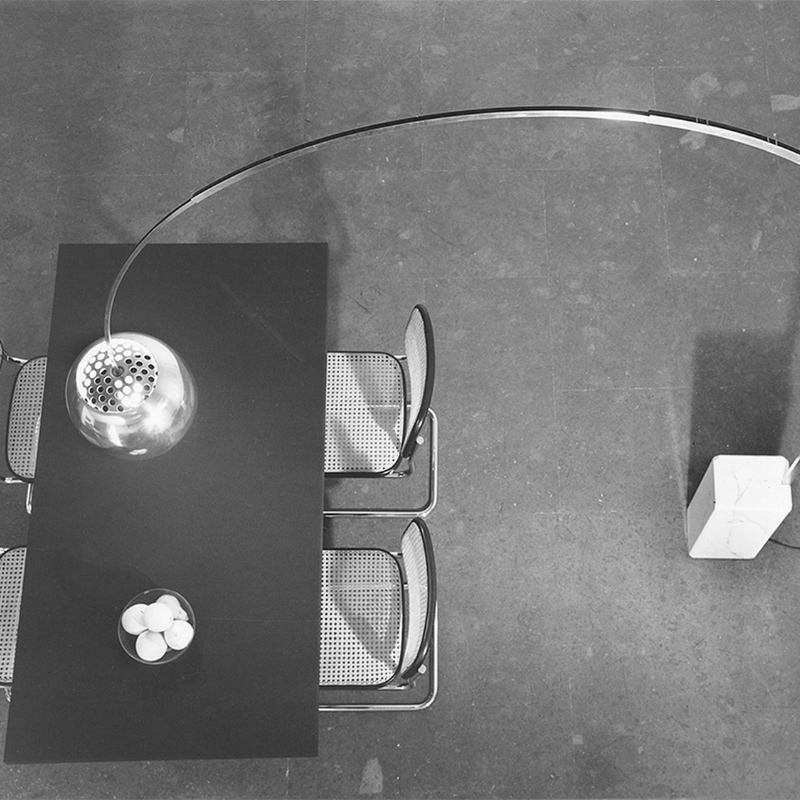 The Arco Floor Lamp from Flos in a dining room.