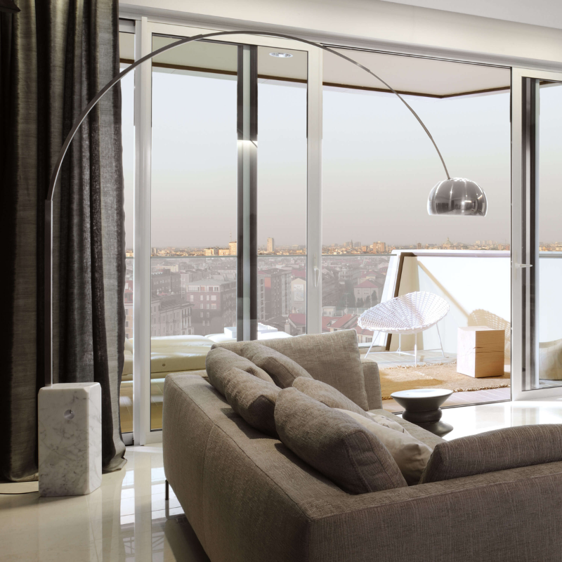 The Arco LED Floor Lamp from FLOS in a living room.