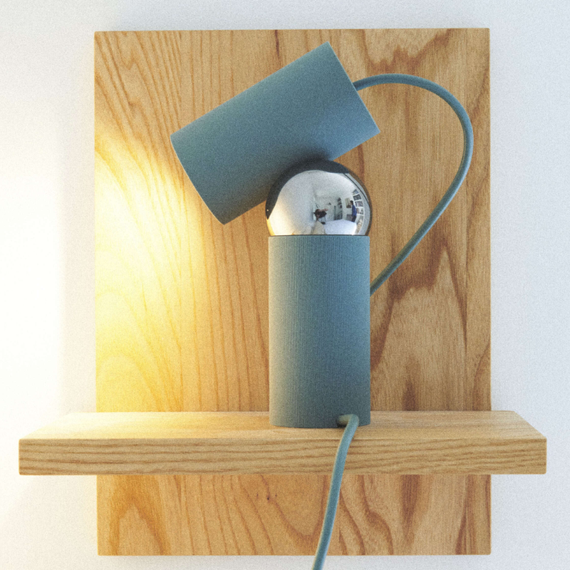 The Bilboquet Table Lamp from FLOS in sage on display.