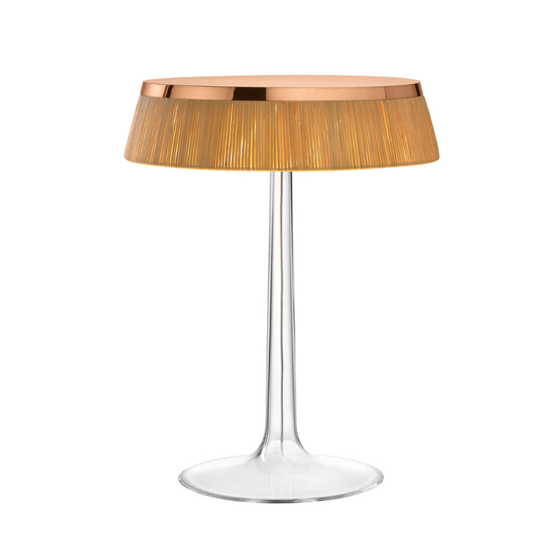 The Bon Jour Table Lamp from Flos in copper with rattan crown.