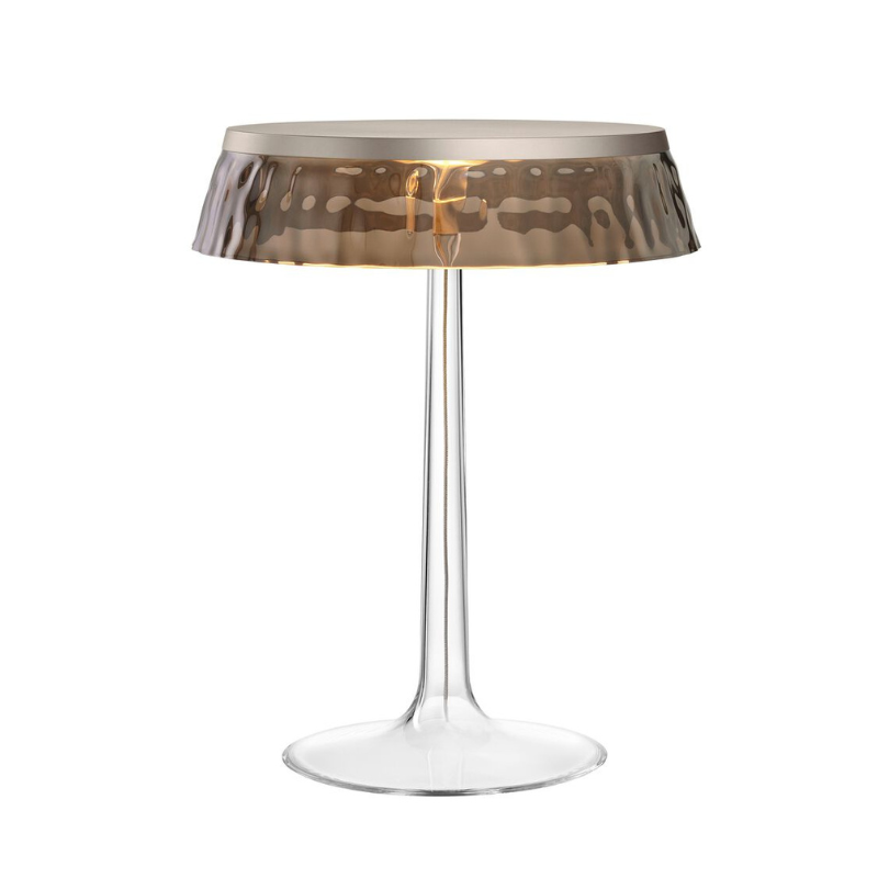 The Bon Jour Table Lamp from Flos in matte chrome with fumee crown.