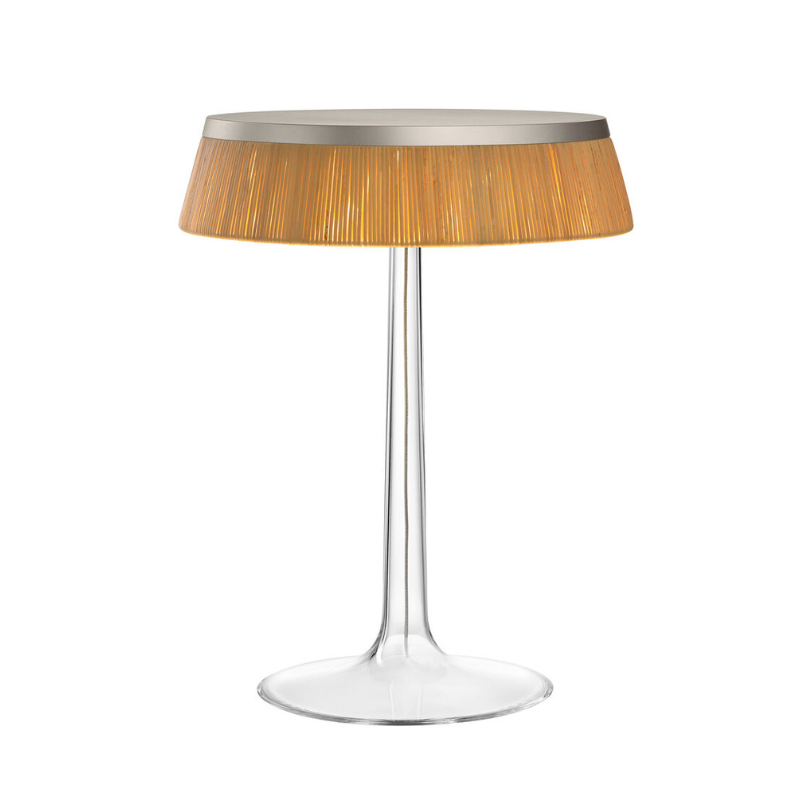 The Bon Jour Table Lamp from Flos in matte chrome with rattan crown.