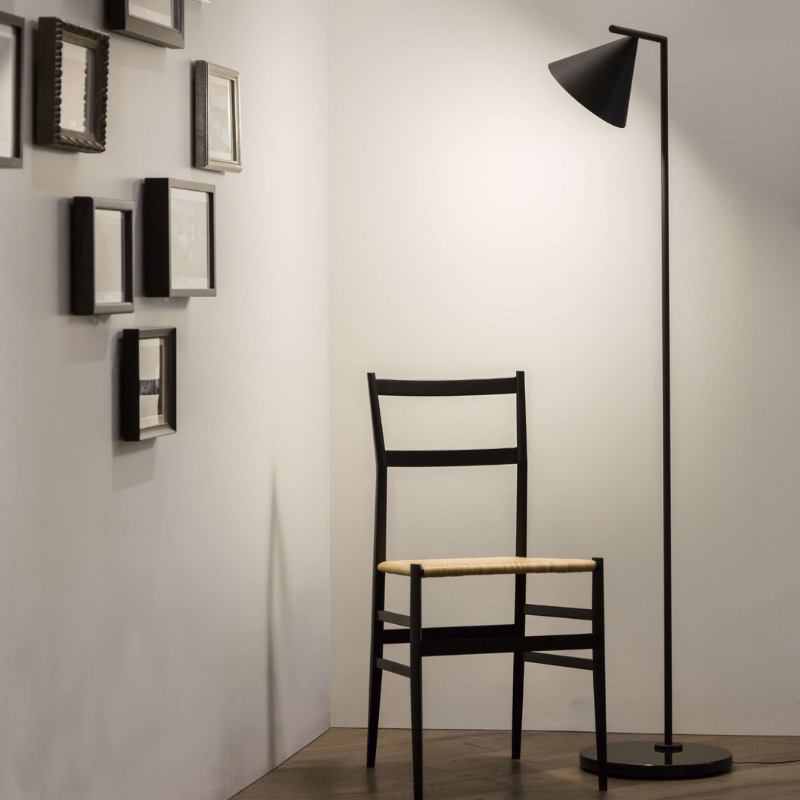 The Captain Flint Floor Lamp by Flos with an adjustable head in a living space.