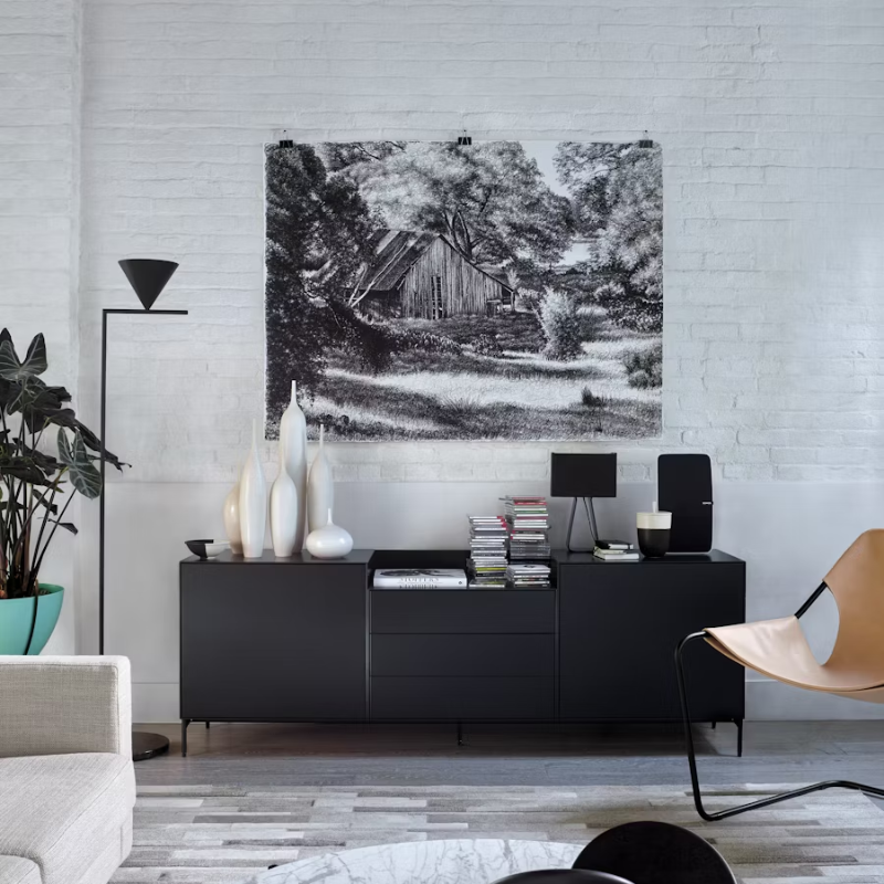 The Captain Flint Floor Lamp by Flos with an adjustable head reading lamp in a living room.