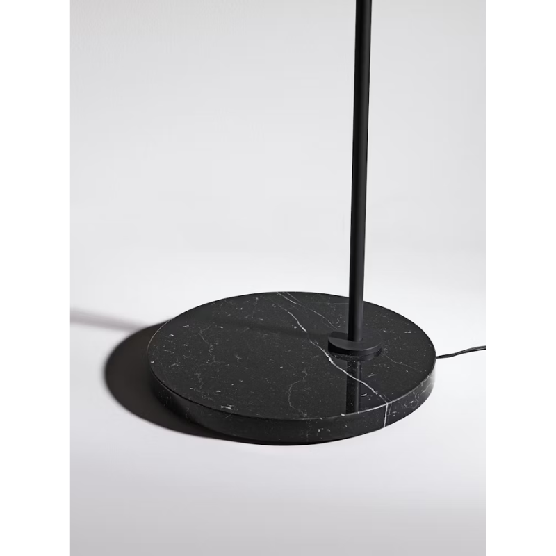 The Captain Flint Floor Lamp by Flos in black, highlighting the marble base.
