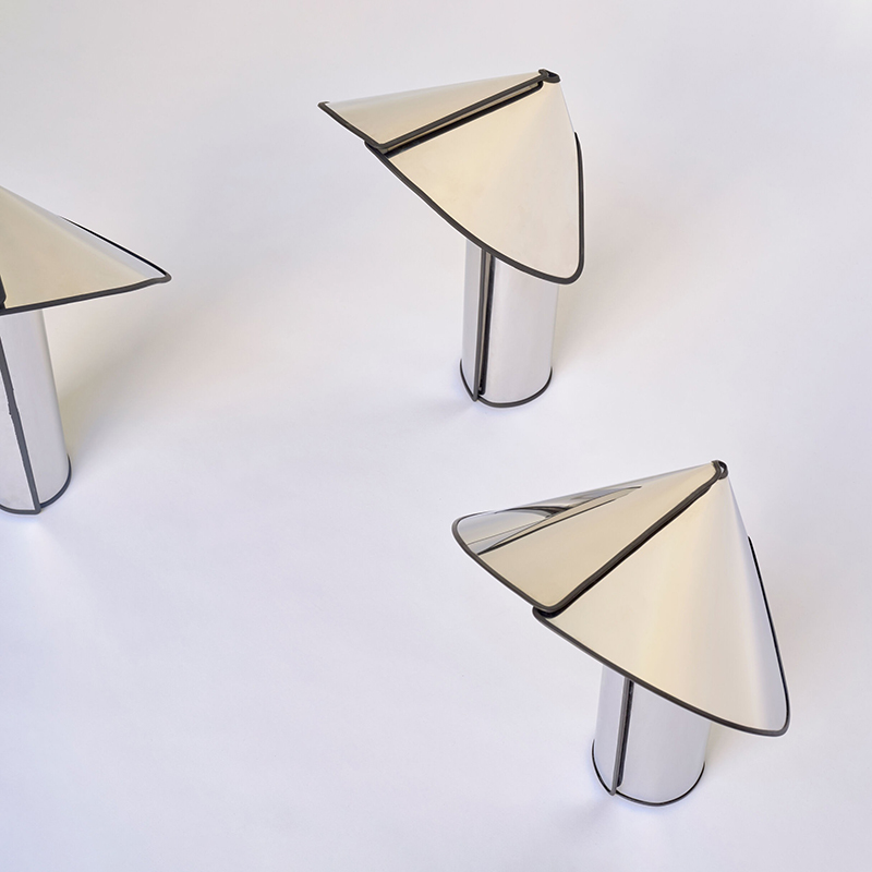 The Chiara Table Lamp from Flos in a living space.