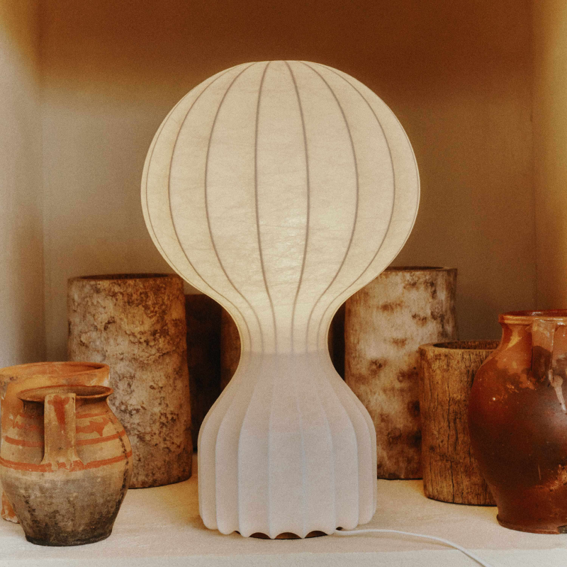 The large Gatto Table Lamp from FLOS in a living room.