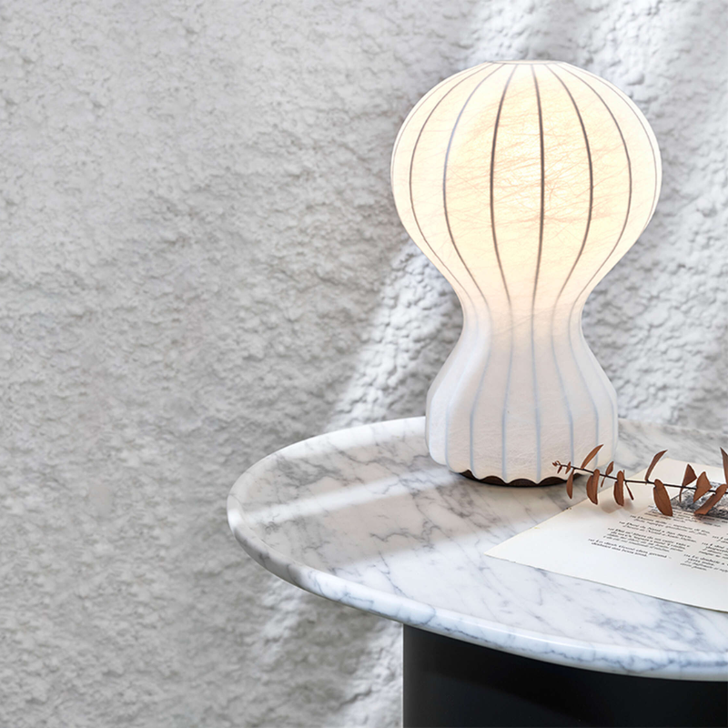 The large Gatto Table Lamp from FLOS in a lounge.