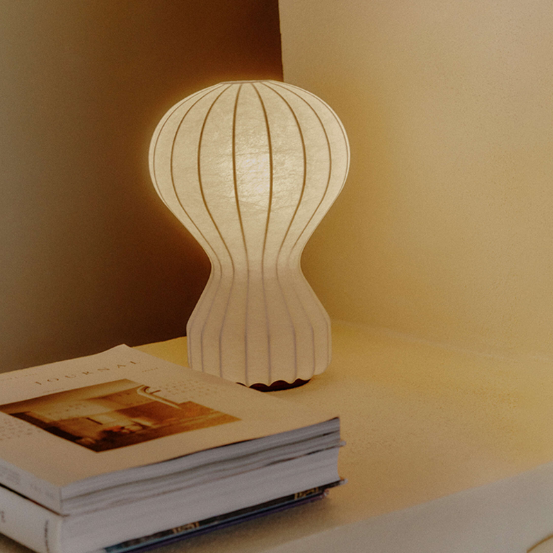The small Gatto Table Lamp from FLOS in a study.