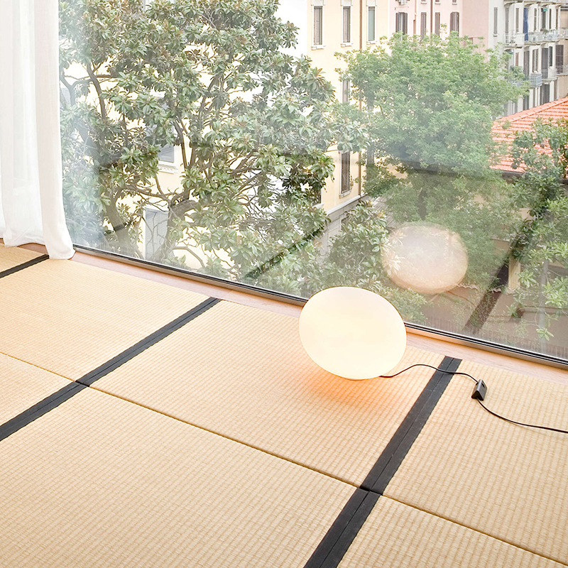 The 13 inch Glo-Ball Basic Table Lamp from Flos in a dining room.
