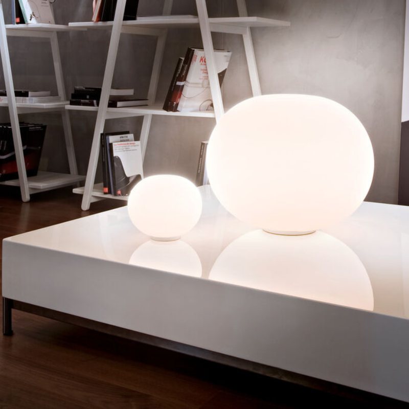 The Glo-Ball Basic Zero Table Lamp from Flos in a living room.