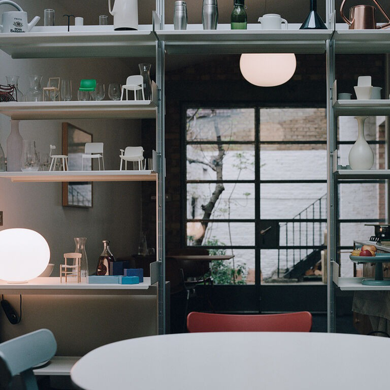 The Glo-Ball Zero Ceiling/Wall Light from Flos in a primary bedroom.