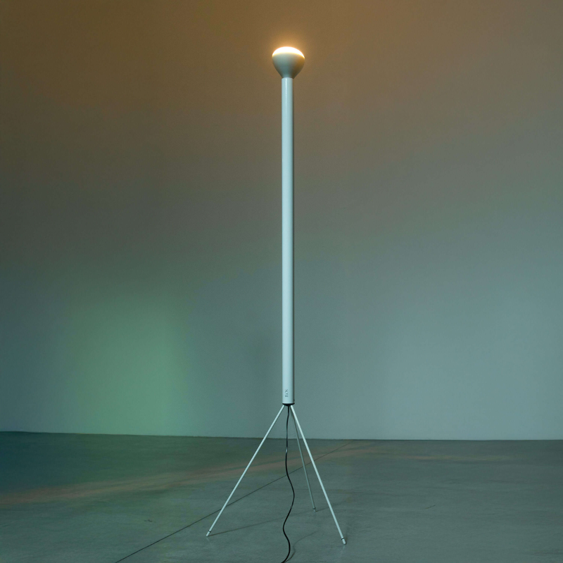 The Luminator Floor Lamp from FLOS in white in a living space.
