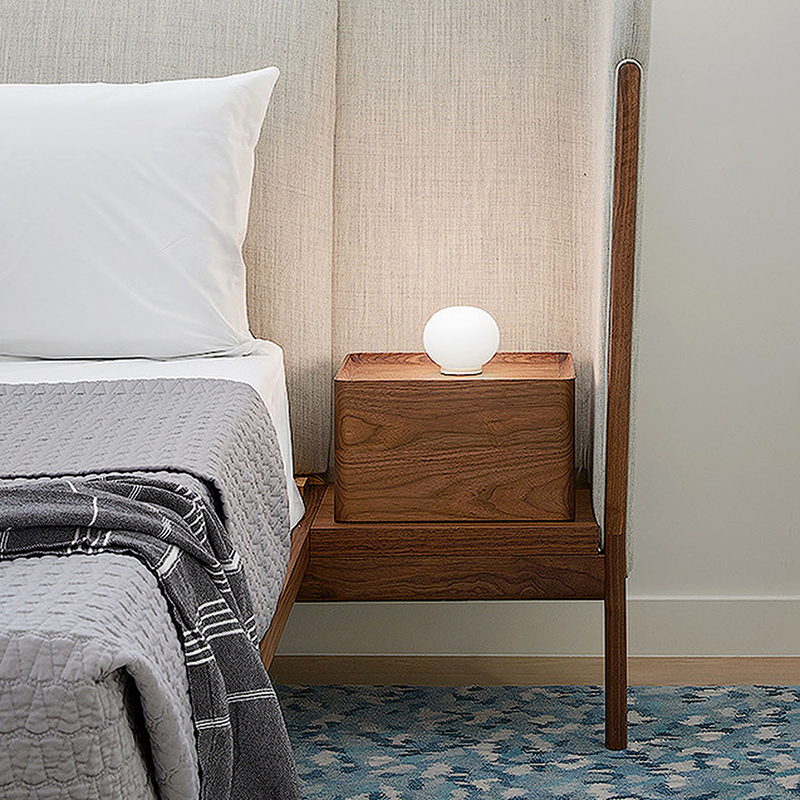 The Mini Glo-Ball Table Lamp from Flos in a primary bedroom.