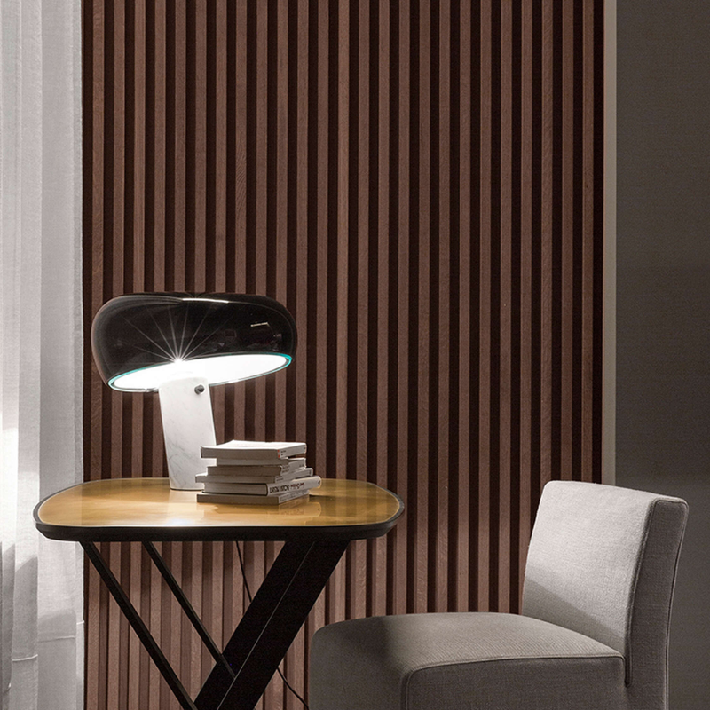 The Snoopy Table Lamp from FLOS in black in a lounge.