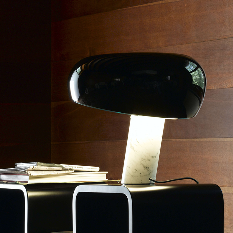 The Snoopy Table Lamp from FLOS in black in an office.