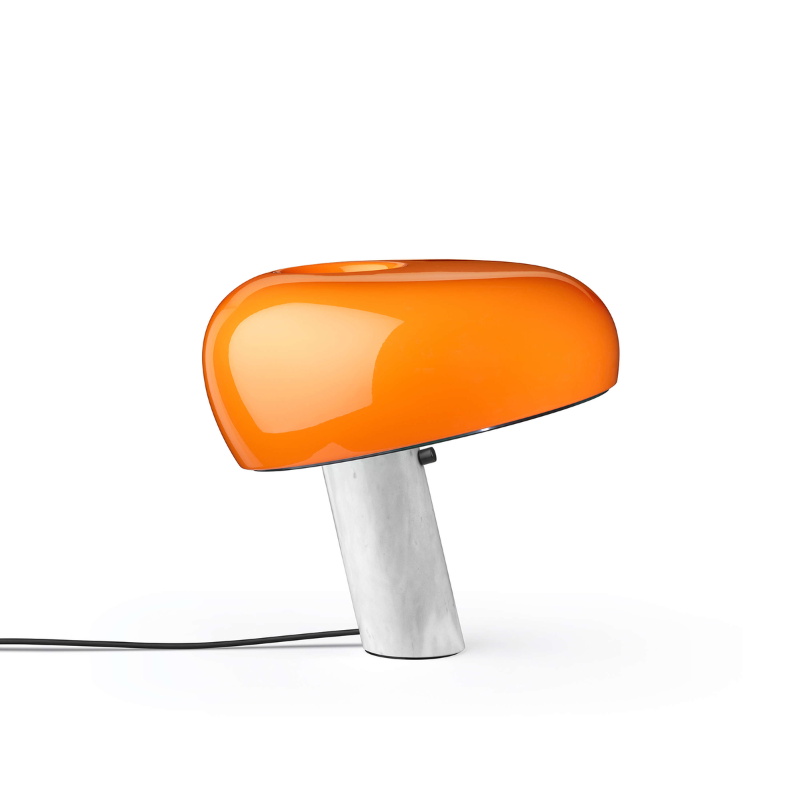 The Snoopy Table Lamp from FLOS in orange.