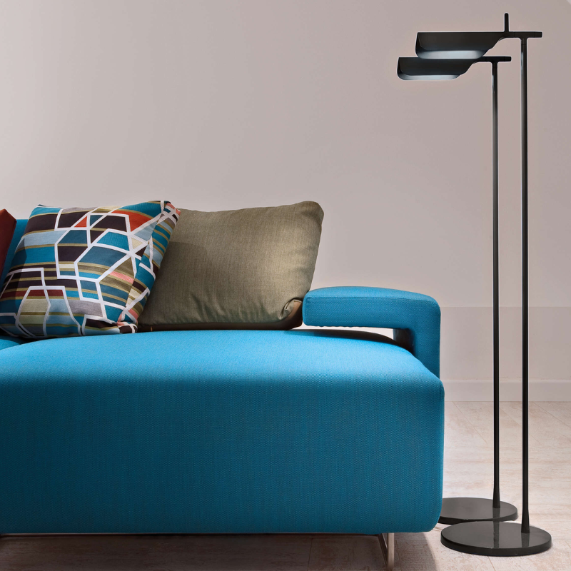 The Tab Floor Lamp from FLOS in black in a family area.