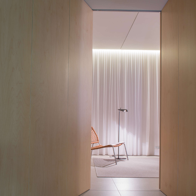 The Tab Floor Lamp from FLOS in black in a lounge.