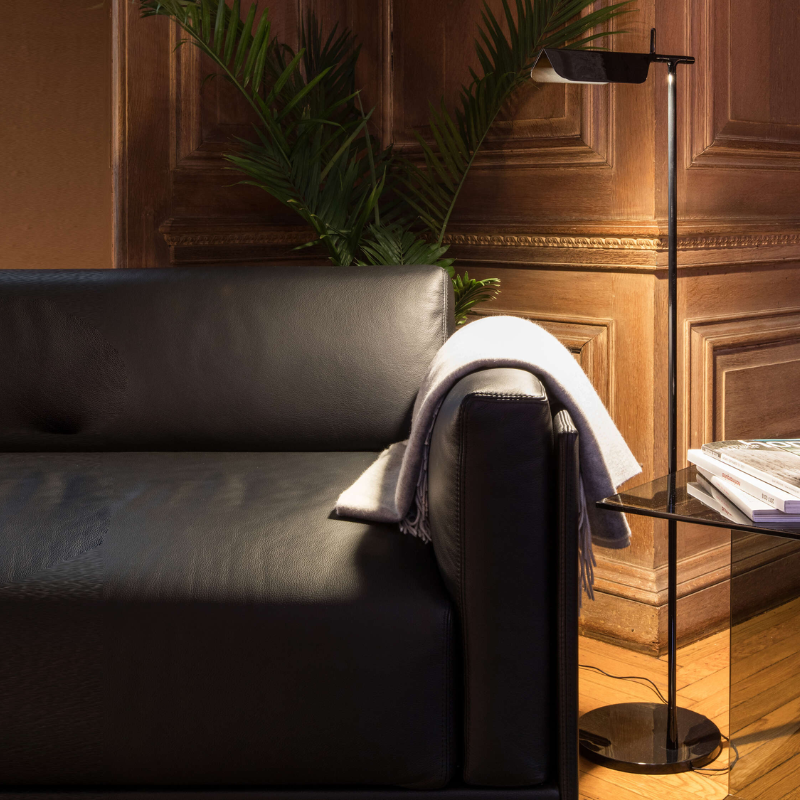 The Tab Floor Lamp from FLOS in black in an office.