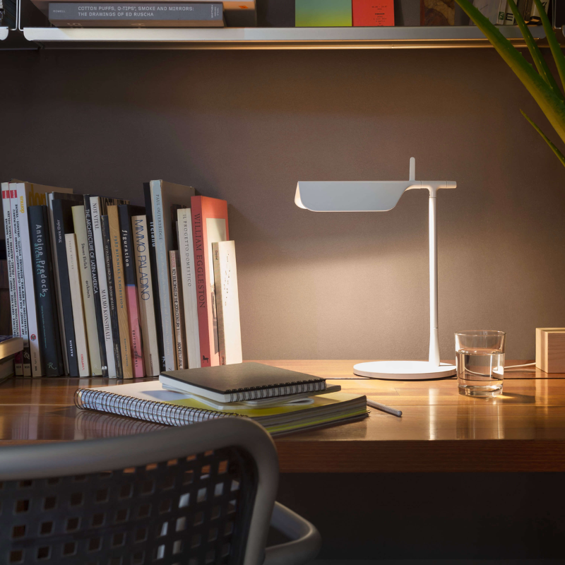 The Tab Table Lamp from FLOS in white in a living room.