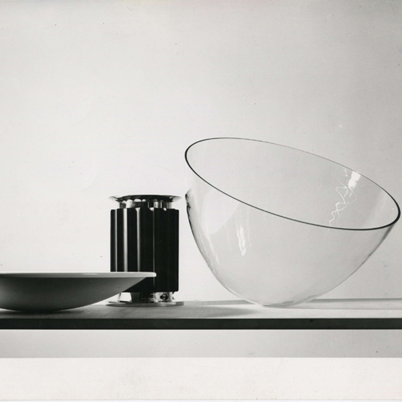 The standard Taccia Table Lamp from FLOS in black in a living space.