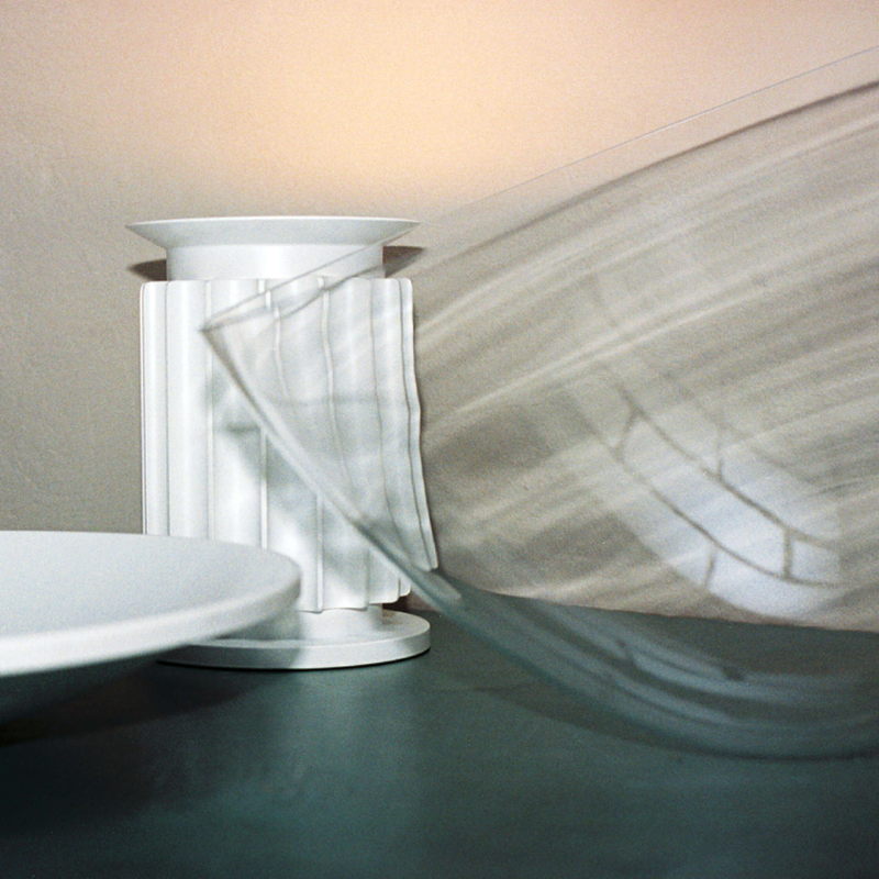 The standard Taccia Table Lamp from FLOS in matte white disassembled.