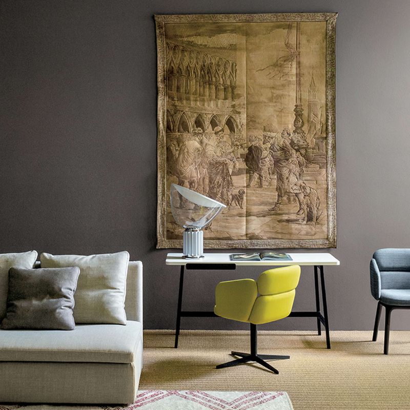 The standard Taccia Table Lamp from FLOS in silver in a home office.