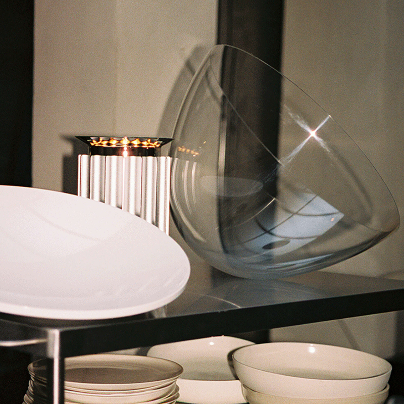 The standard Taccia Table Lamp from FLOS in silver in a study.