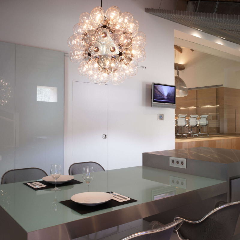 The Taraxacum 88 Suspension from FLOS in a dining room.
