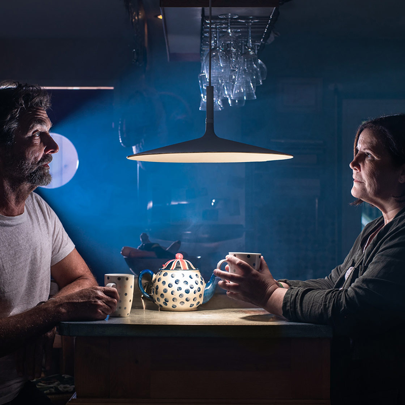 The Aplomb Large Pendant from Foscarini in anthracite in a dining room.