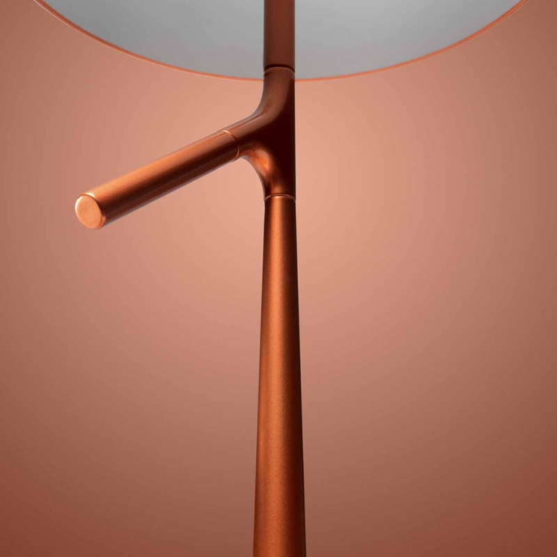 The Birdie Table Lamp from Foscarini in copper in a close up.