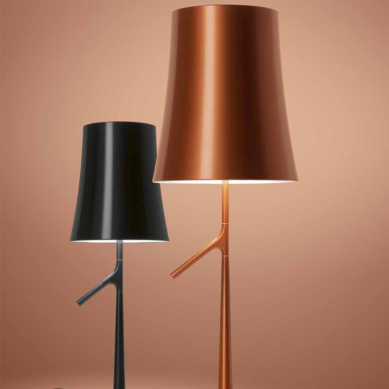 The Birdie Table Lamp from Foscarini in copper and graphite showing the size options.
