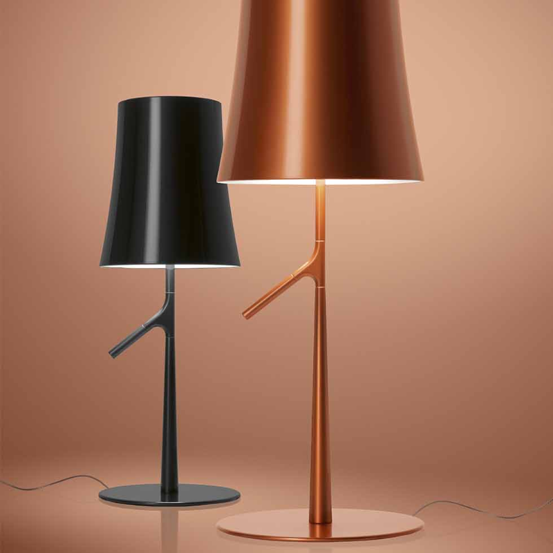 The Birdie Table Lamp from Foscarini in graphite and copper showing the color options.
