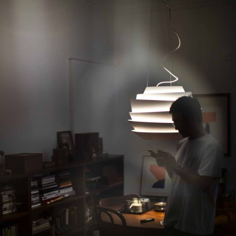 The Le Soleil Pendant from Foscarini in a living room.