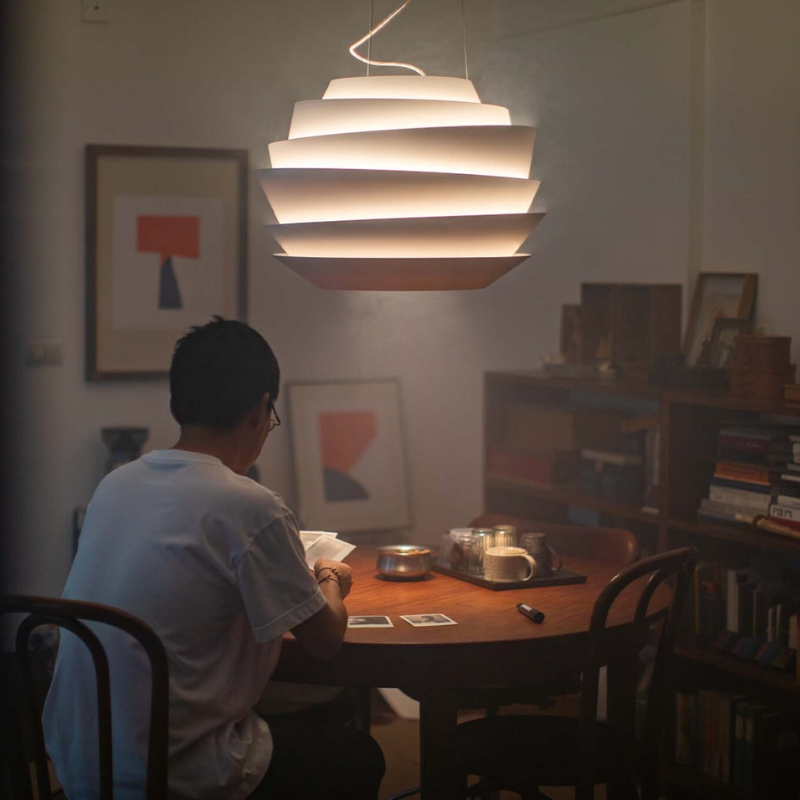 The Le Soleil Pendant from Foscarini in a lounge.