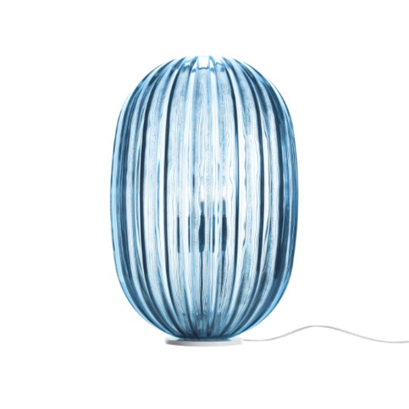 The Plass Table Lamp from Foscarini in light blue.