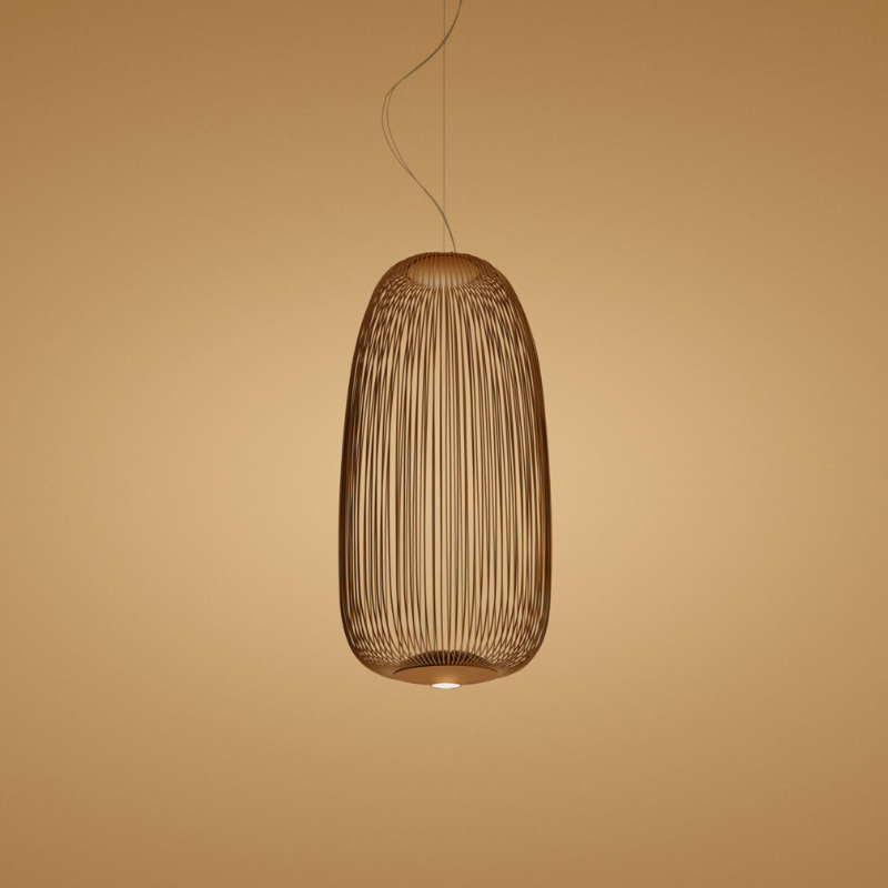 The Spokes 1 from Foscarini in copper in a studio.
